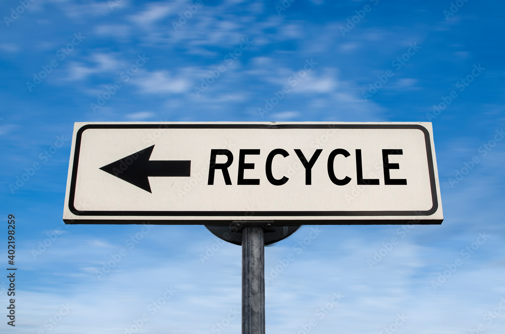 Recycle road sign, arrow on blue sky background. One way blank road sign with copy space. Arrow on a pole pointing in one direction. Recycle road sign, arrow on blue sky background. One way blank road sign with copy space. Arrow on a pole pointing in one direction.