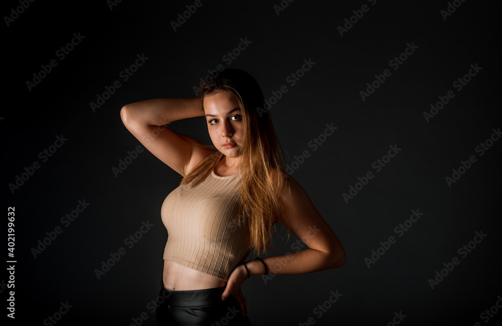 Fototapeta premium Attractive woman happy smile isolated over dark background