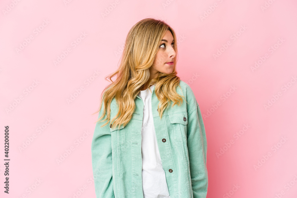 Young caucasian blonde woman confused, feels doubtful and unsure. Young caucasian blonde woman confused, feels doubtful and unsure.