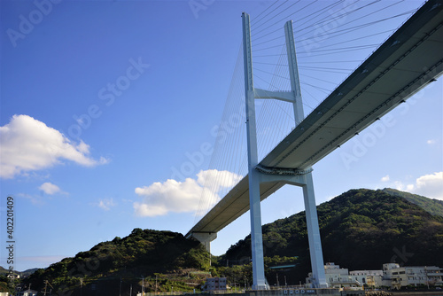 View of Megami Ohashi Bridge, Venus Wing, from Gunkanjima tour boat in Nagasaki, Japan - 長崎 女神大橋 