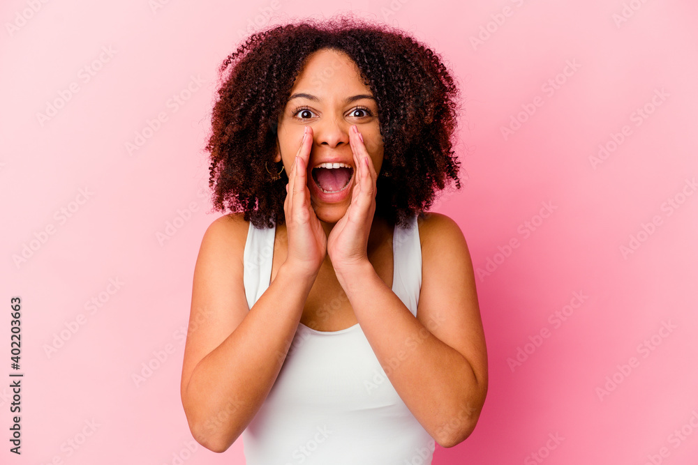 Young african american mixed race woman isolated shouting excited to front. Young african american mixed race woman isolated shouting excited to front.
