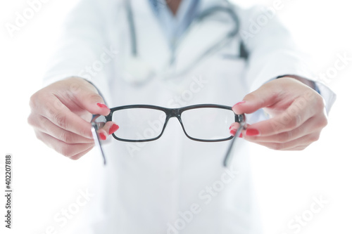 Optometrist holding a pair of glasses