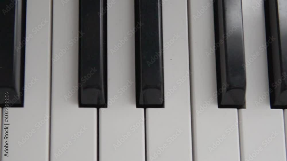 Close-up, electronic piano keys, slow-motion shooting. Close-up, electronic piano keys, slow-motion shooting.