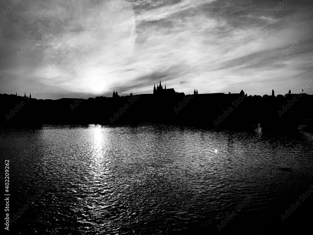 Sunset, reflection in the river. Monochrome. Prague, Czech Republic, Europe