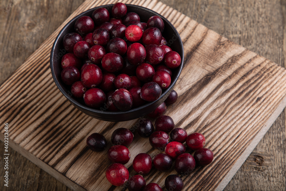 cranberries on a wooden table cranberries on a wooden table