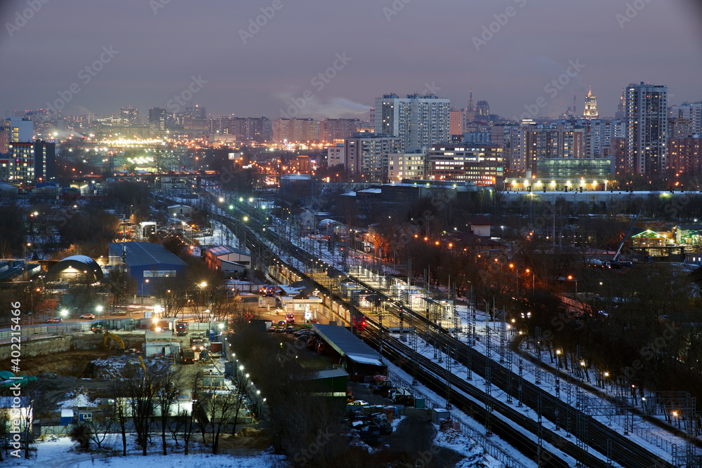 Fototapeta premium Moscow, Russia. Desember 23 2020: Trains and the Moscow skyline. Ostankino railway platform.