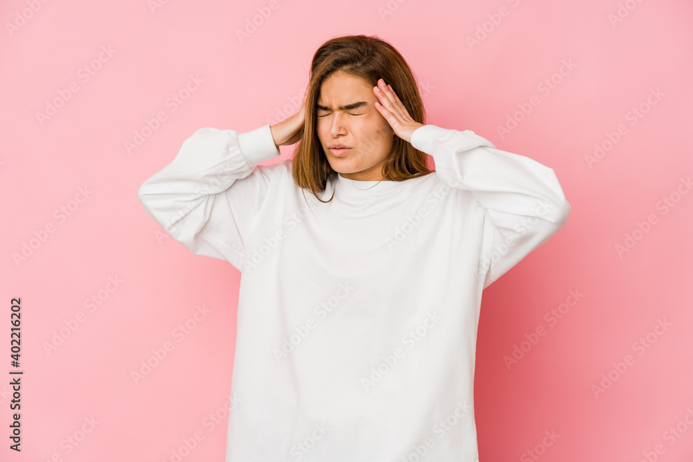 Young skinny caucasian teenager girl touching temples and having headache. Young skinny caucasian teenager girl touching temples and having headache.