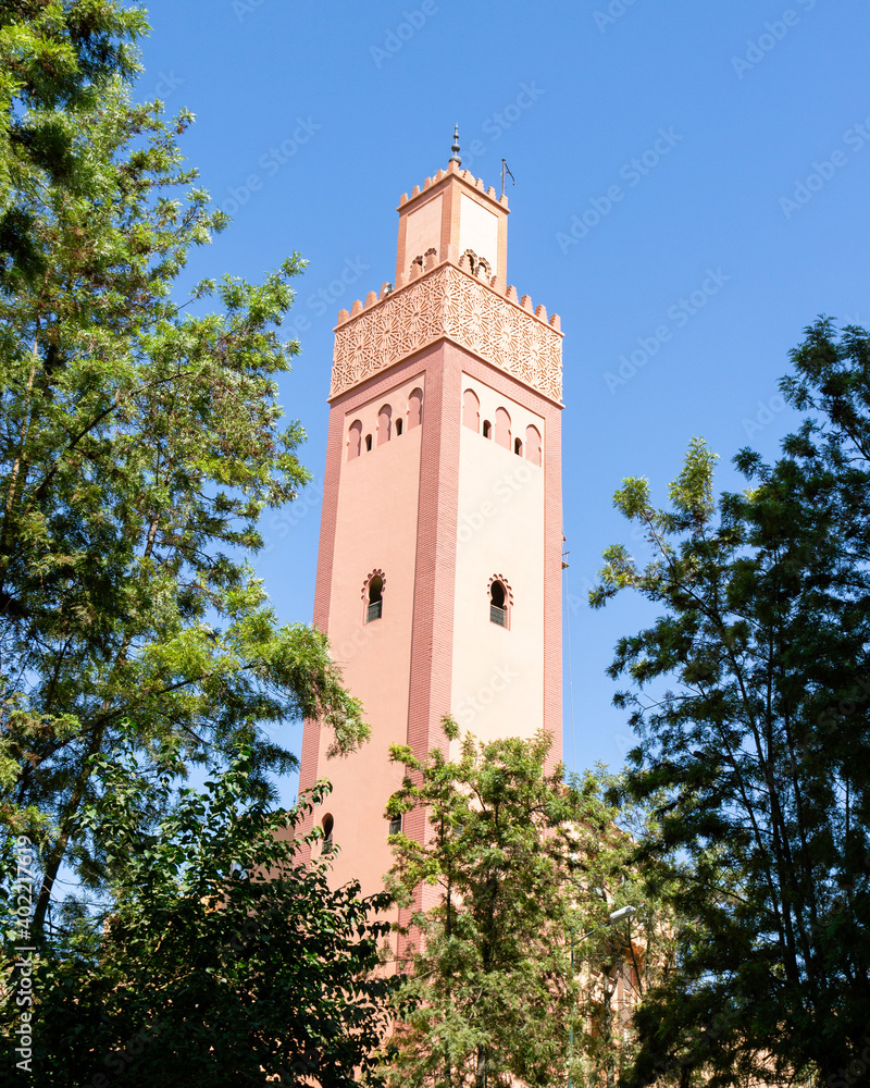 Minaret of a Mosque Of Turkey at Marrakesh, Morocco against blue sky background