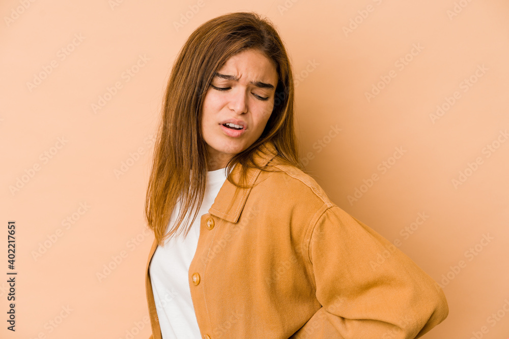 Young skinny caucasian teenager girl suffering a back pain. Young skinny caucasian teenager girl suffering a back pain.