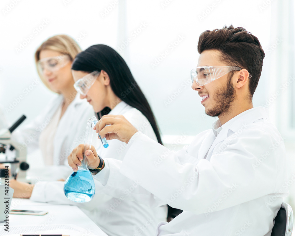 group of scientists conduct research in the laboratory group of scientists conduct research in the laboratory