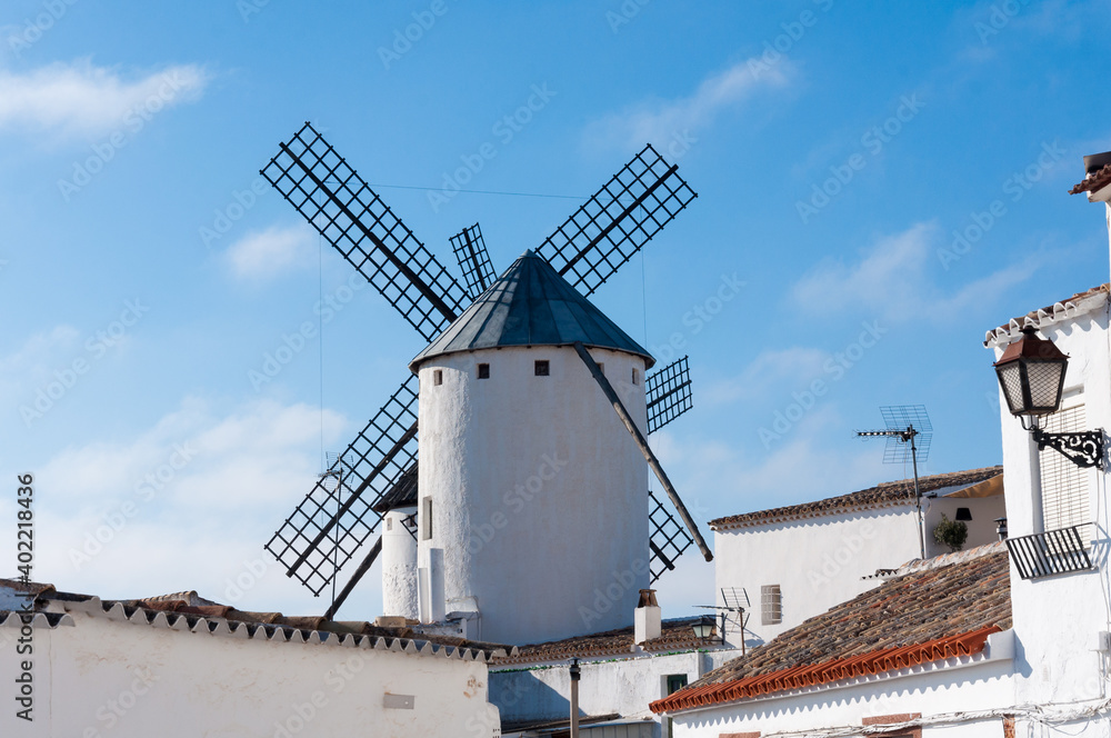 Beautiful landscape with windmills in the streets of Campo de Criptana, La Mancha, Spain Beautiful landscape with windmills in the streets of Campo de Criptana, La Mancha, Spain