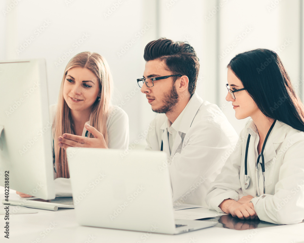 group of medical experts discussing online information. group of medical experts discussing online information.