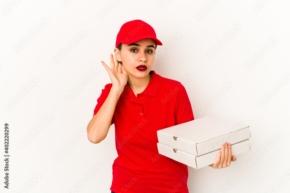 Young skinny arab pizza delivery girl relaxed thinking about something looking at a copy space. Young skinny arab pizza delivery girl relaxed thinking about something looking at a copy space.