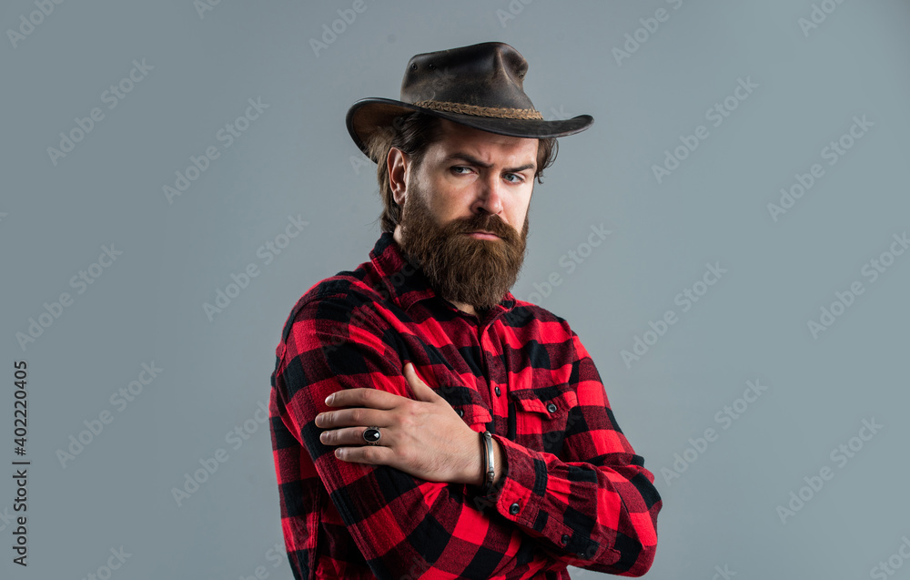Confident cowboy man with stylish facial hair, beard and mustache