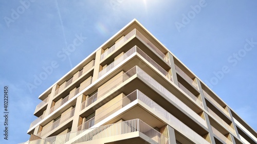 Apartment residential house and home facade architecture and outdoor facilities. Blue sky on the background. Sunlight