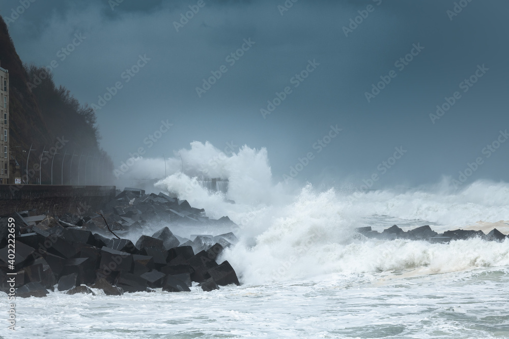 Waves breaking on the New Promenade of San Sebastian during the storm Bella, Spain