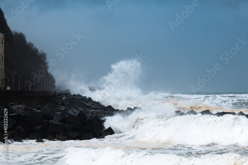 Waves breaking on the New Promenade of San Sebastian during the storm Bella  Spain