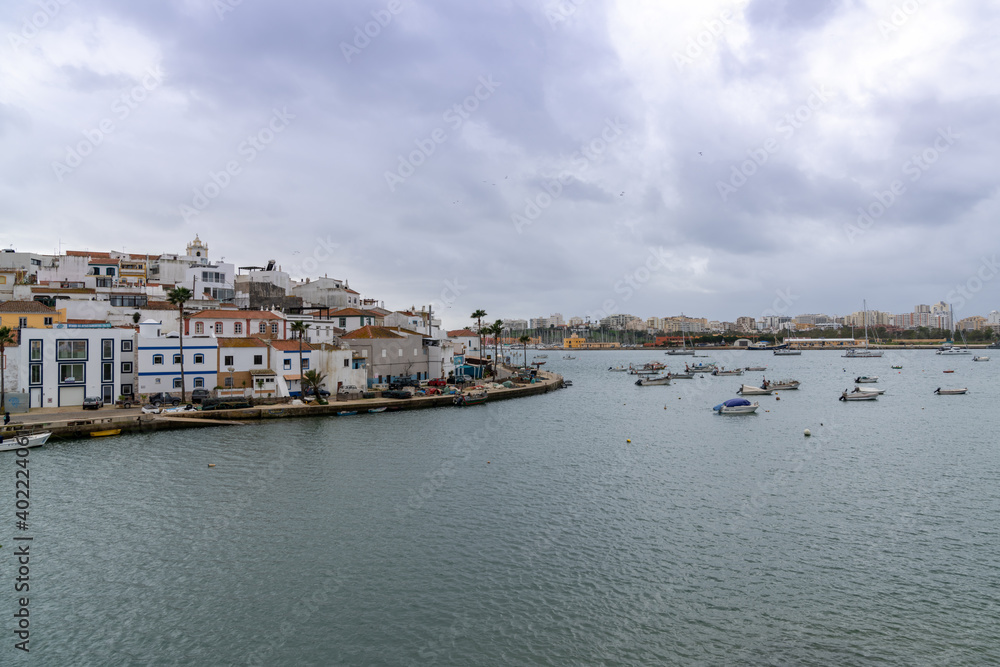 view of the quaint fishing village of Ferragudo on the Algarve coast of Portugal