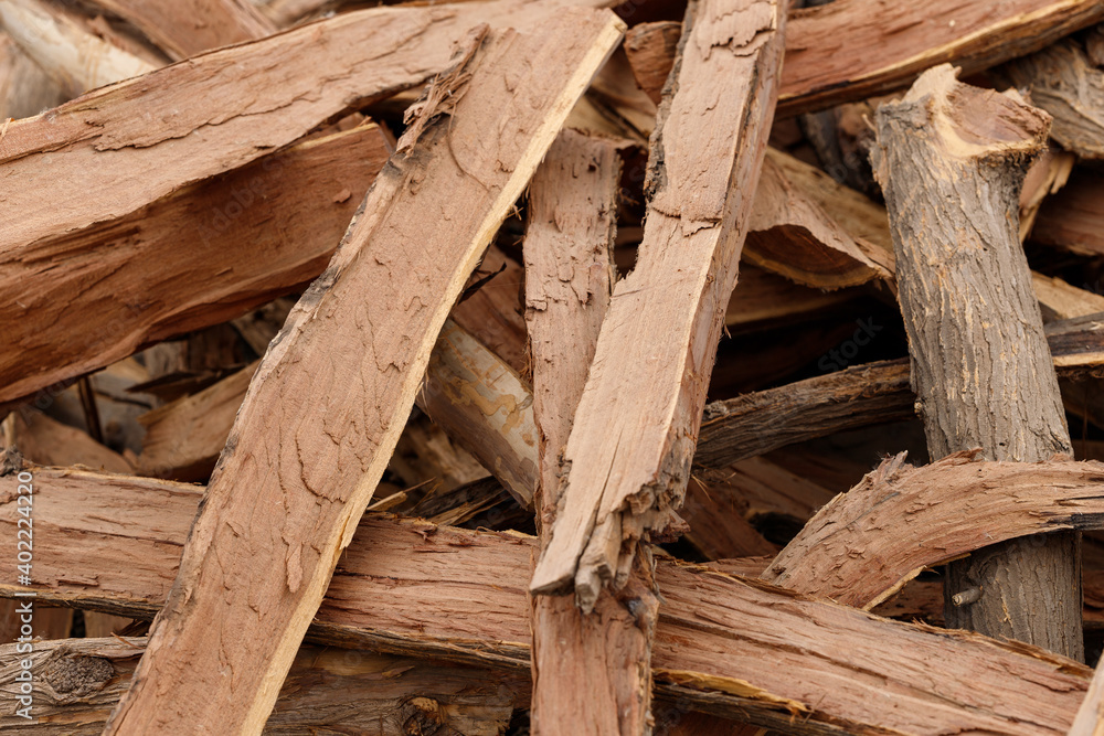 many pieces of wood stacked in a pile to form an interesting pattern many pieces of wood stacked in a pile to form an interesting pattern