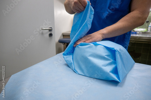 in hospital sterilization department, a surgical saline dish is wrapped in paper