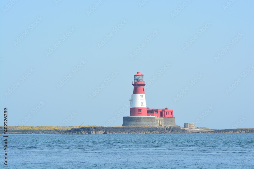 A lighthouse on the rocks of the Farne islands A lighthouse on the rocks of the Farne islands