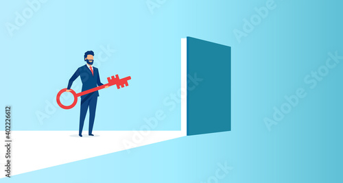 Vector of a business man holding a key to a door to success
