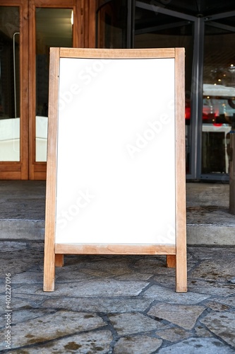 Empty menuboard on in front of a restaurant, blank white sign board, no text