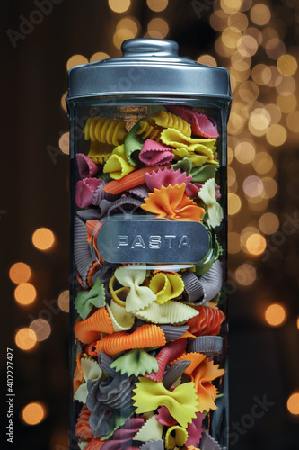 Different colored pasta in a glass photo