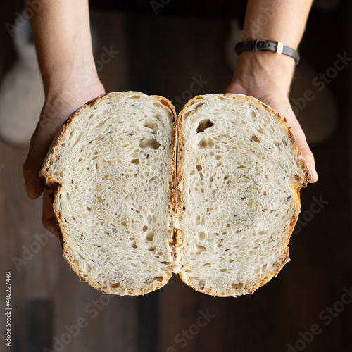 Fotografie, Obraz Seeded sourdough bread cut into two halves