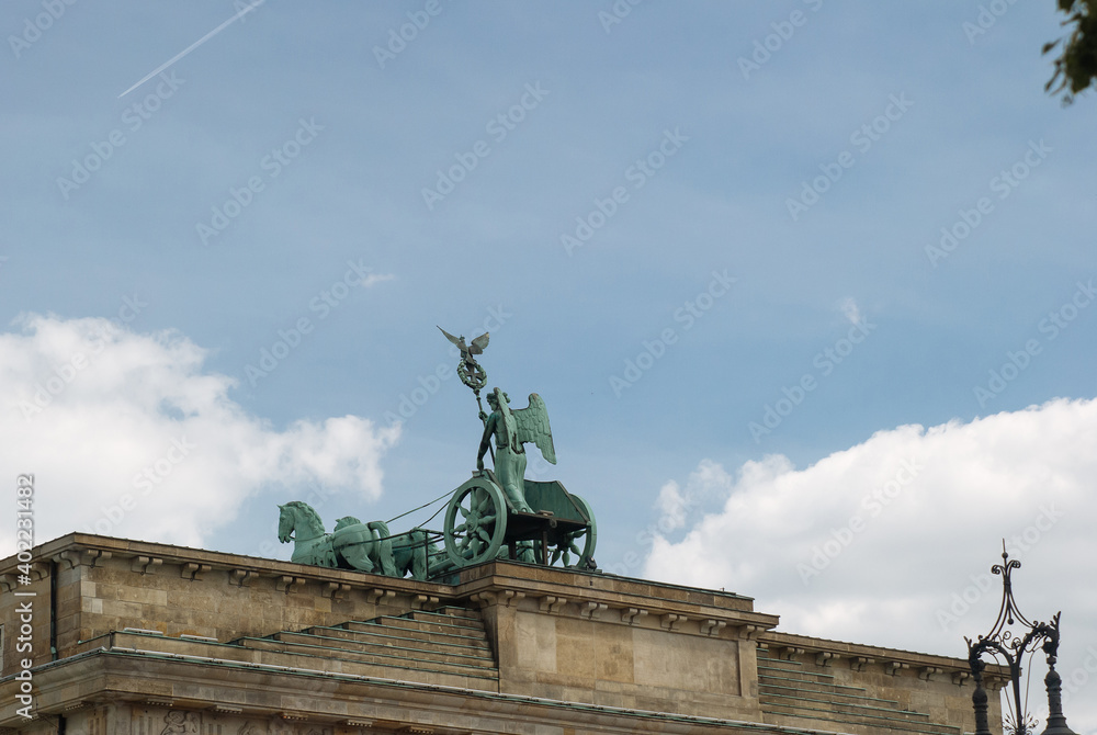 The sculptural group of the Brandenburg Gate. The ancient Greek goddess of Peace Irena in a chariot with four horses. Back view.