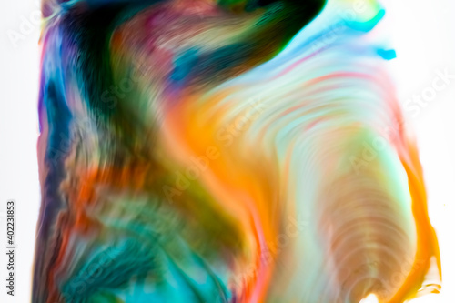 Food coloring and soap in milk creating bright colorful abstract background and patterns
