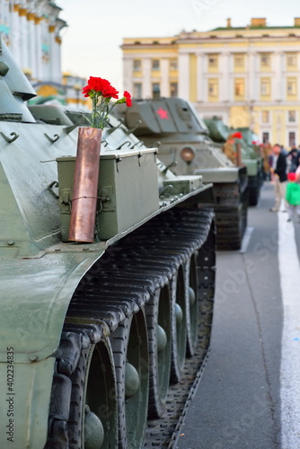 Red carnations in a gun cartridge on a heavy Soviet tank KV-1 at the Palace square