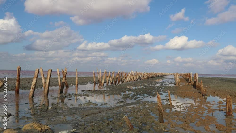 Timelapse video - running clouds in the blue sky over the salt lake, where salt is extracted Timelapse video - running clouds in the blue sky over the salt lake, where salt is extracted