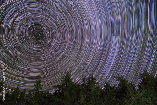 Long exposure timelapse night sky and star trails over Prince Edward Island national park