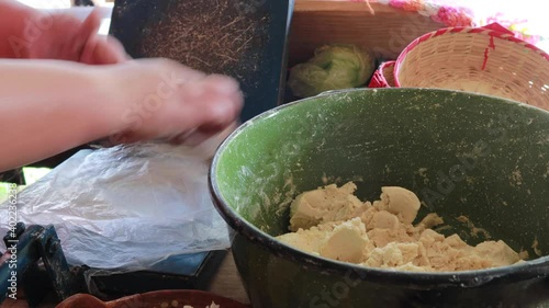 Authentic hands preparing mexican tortillas with dough