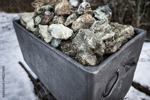 Old historic mining cart full of stones in Spisske Bystre village, Slovakia photo