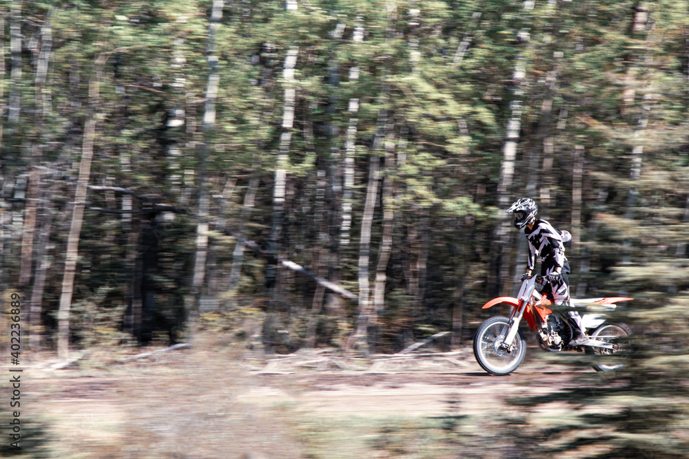 Dirt bike rider standing high speed motorbike Dirt bike rider standing high speed motorbike