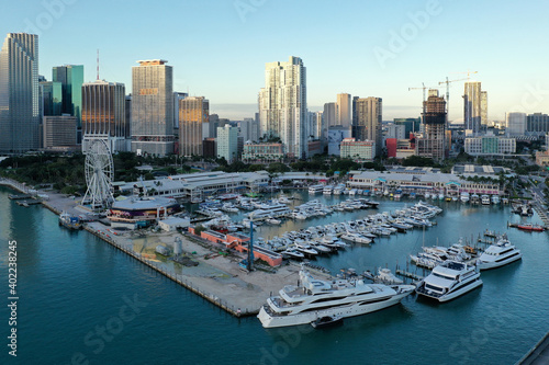 Miami, Florida - December 27, 2020 - Aerial view of Bayside Marketplace, City of Miami Marina and Miami skyline on sunny winter morning.