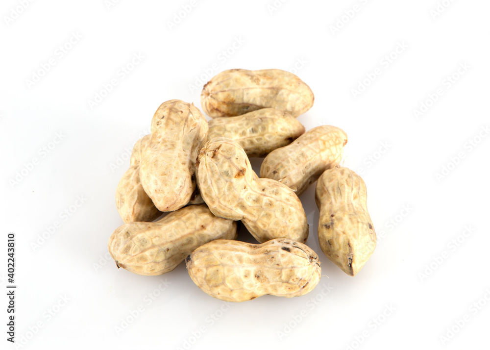 A pile of peanuts on white background A pile of peanuts on white background
