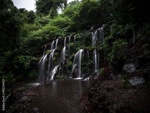 Long exposure of Banyu Wana Amertha Amerta waterfall air terjun in Wanagiri Buleleng northern Bali Indonesia photo