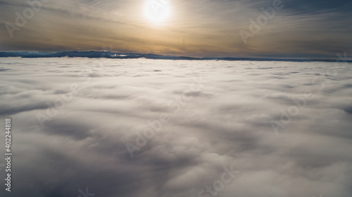 view from well above the valley covered in fog