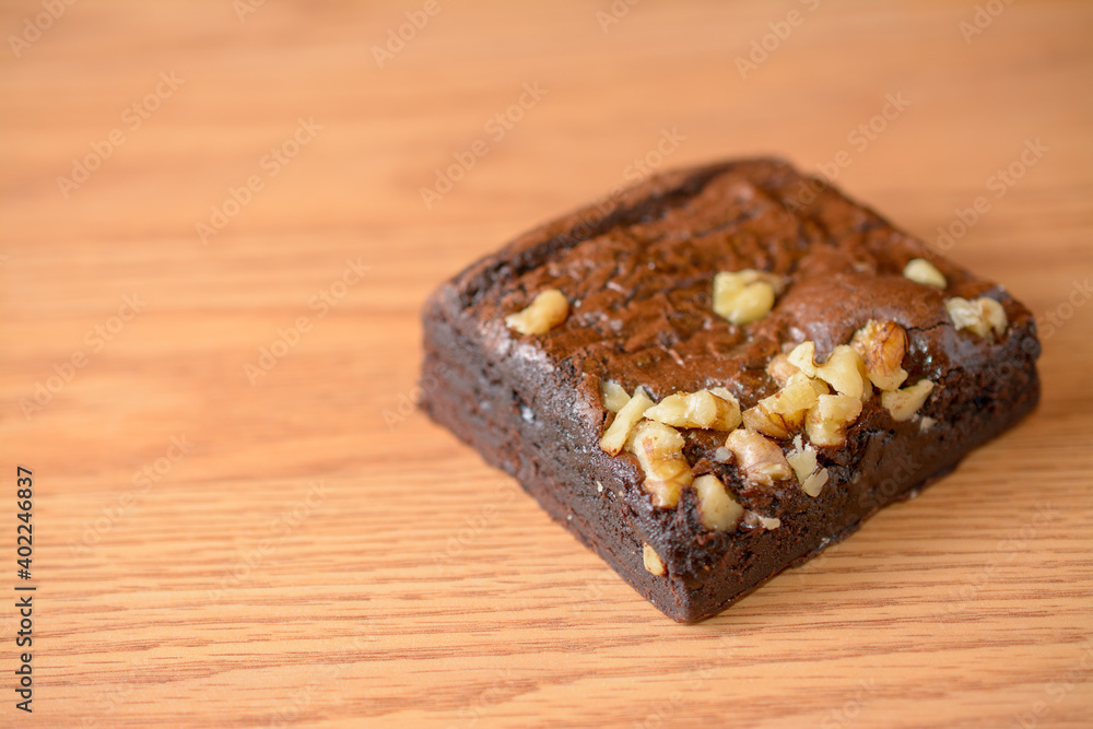 Rich chocolate brownie topped with chopped walnuts