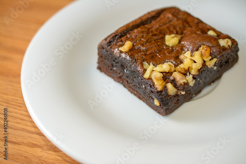 Rich chocolate brownie topped with chopped walnuts