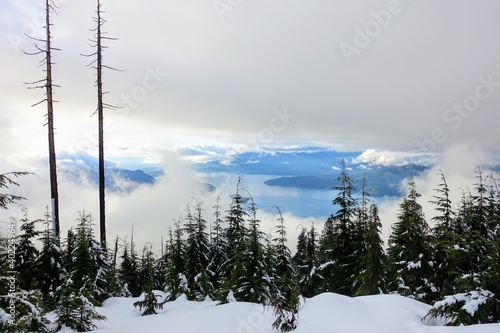 A beautiful view of the ocean and islands below of howe sound from the bowen lookout trail on Cypress Mountain, outside Vancouver, British Columbia, Canada