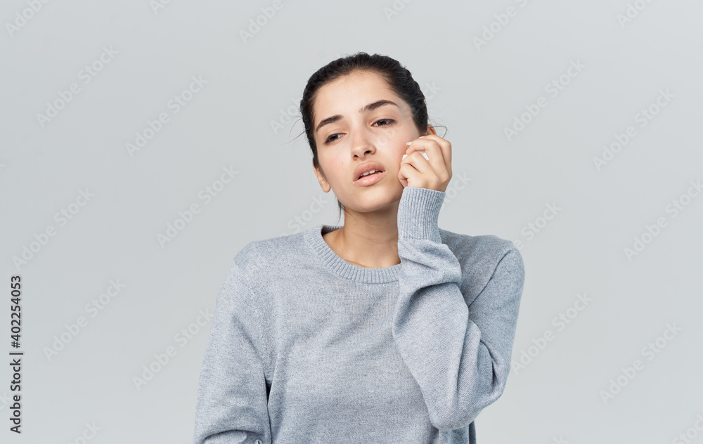 Health problems young woman with napkin runny nose disease gray background Health problems young woman with napkin runny nose disease gray background