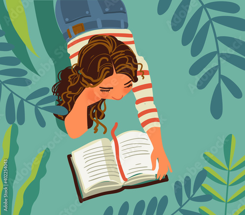 Cute girl reads a book
