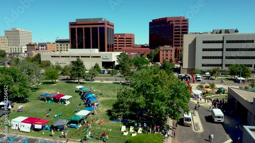 Aerial view of park in downtown Colorado Springs, CO during festival view of skyline