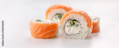 Obraz  z motywem Philadelphia roll sushi on a white plate. Isolated. Restaurant concept. Close-up.