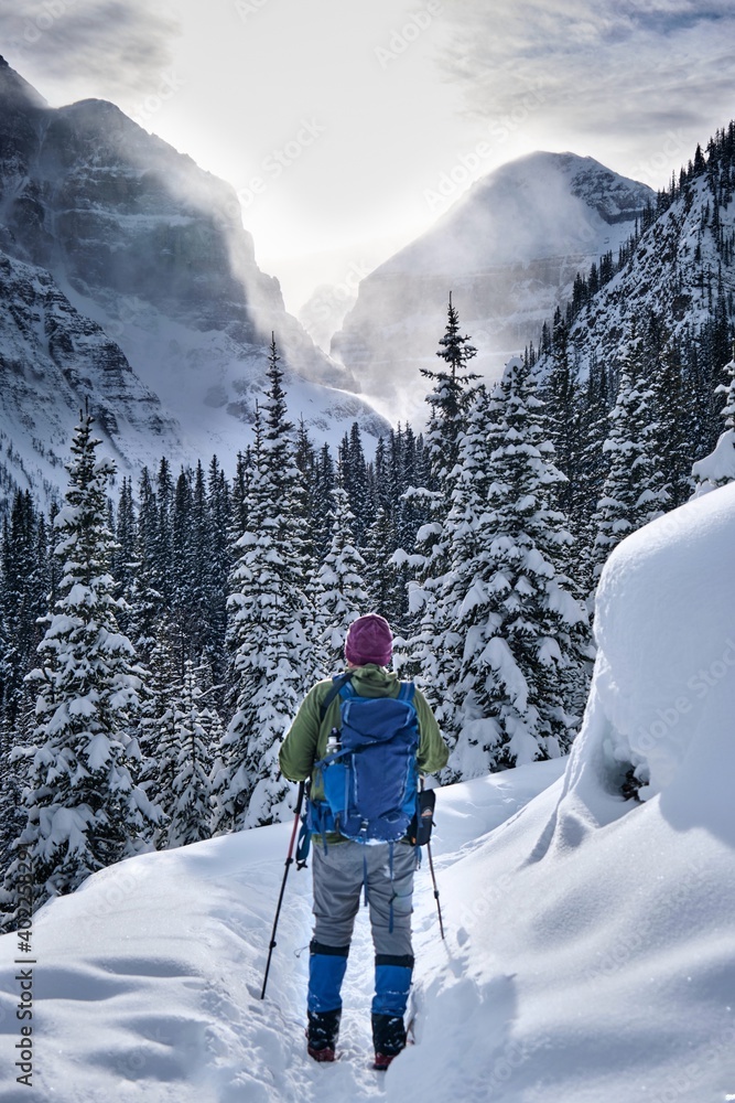 Man hiking on snow in Banff National Park. Lake Louise area. Alberta. Canada. 