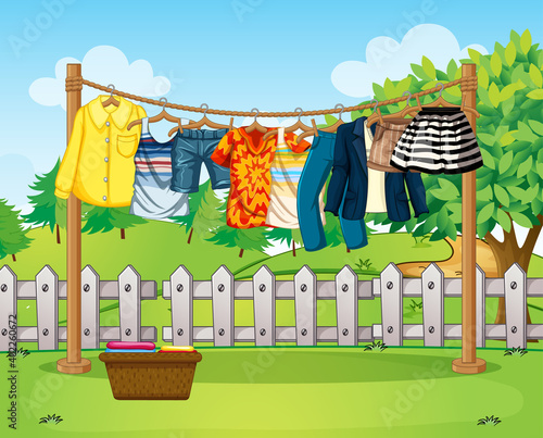 Many clothes hanging on a line outside the house scene